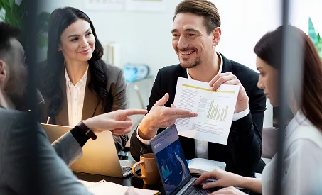 Xionnix professionals analysing reports during meeting