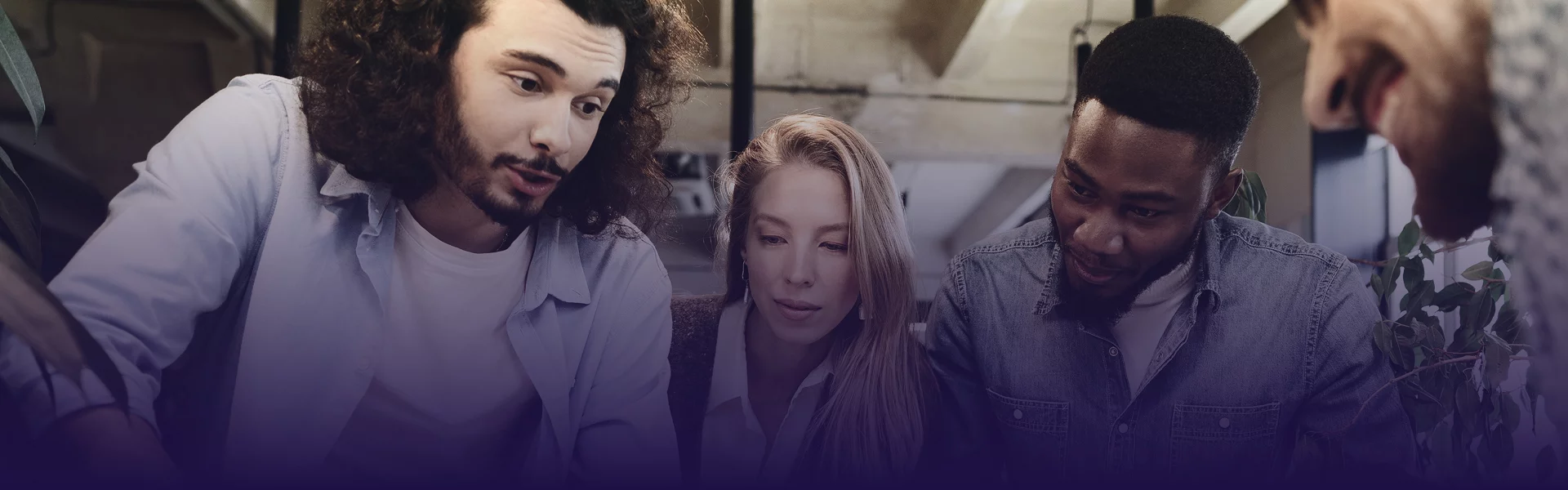 Diverse Xionnix team collaborating on a digital strategy project in a modern workspace