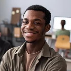 Young professional in an office setting, highlighting Xionnix’s top-tier video editing services.