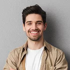 Smiling individual in a beige shirt, showcasing Xionnix’s leading SEO optimization services.